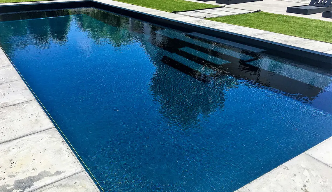 [exp_site_title] The Grand in Ebony Blue. Fiberglass pool with a large rectangular shape perfect for kids.