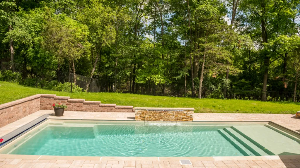 Inground fiberglass pool installed by Leisure Pools Hudson Valley in Elmsford, NY